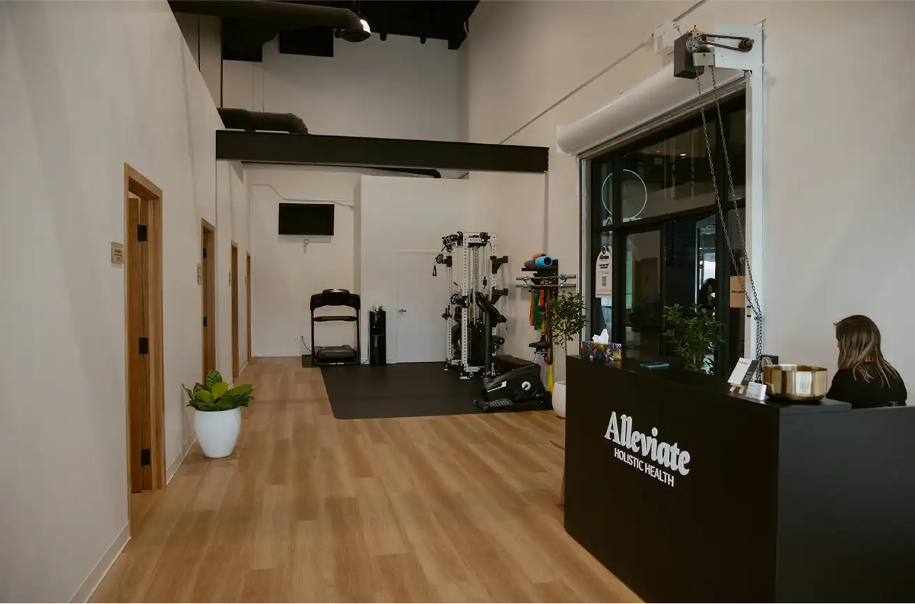 Alleviate Holistic Health reception desk and lobby at our wellness clinic Winnipeg location